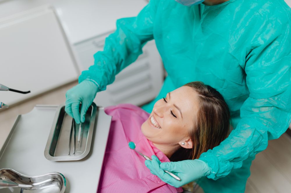 a woman is getting dental treatment.