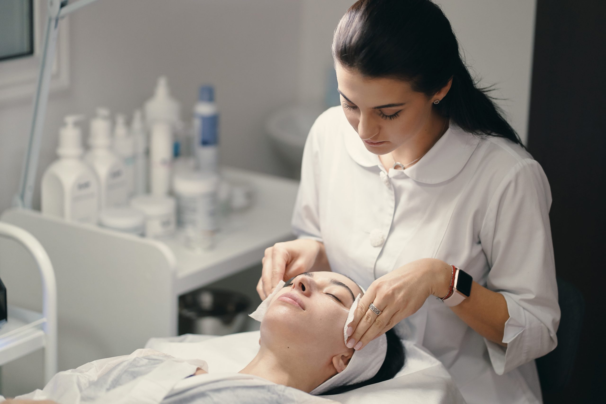 Female Cosmetologist Making Facial Treatment Beautiful Woma Scaled